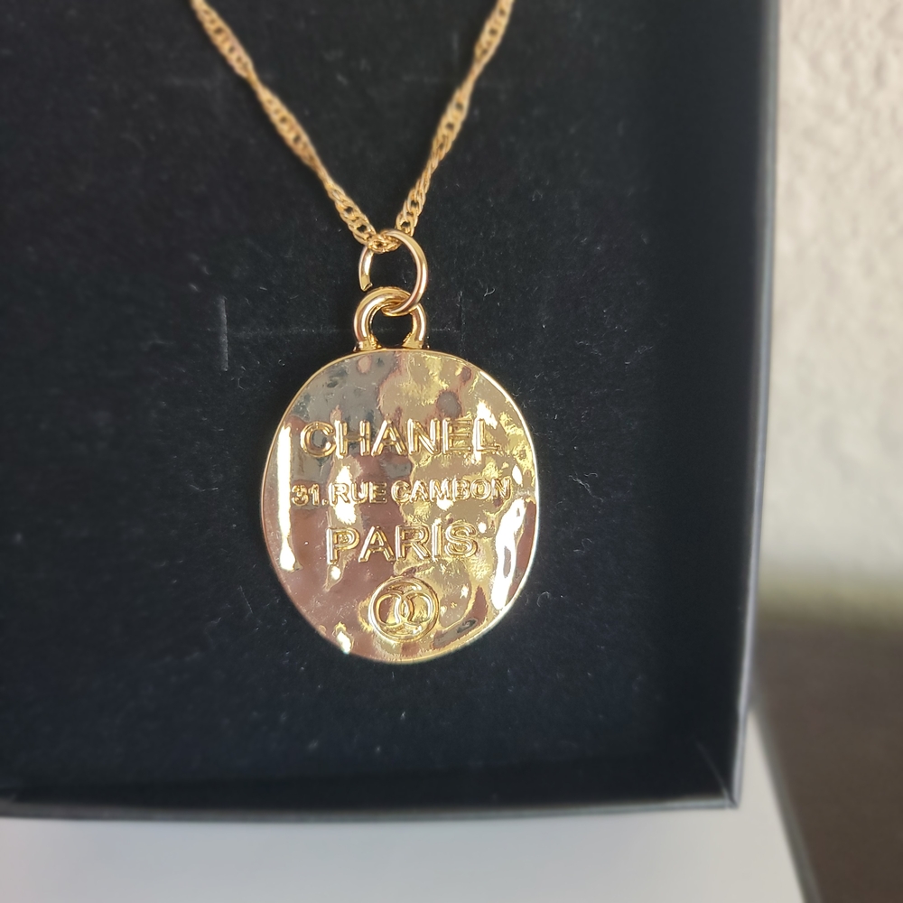 CHANEL Gold Textured Pendant Necklace